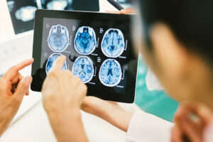 Doctor and patient engaging with a digital tablet, symbolizing the rise of Software as a Medical Device (SaMD) as a core enabler of intelligent, connected healthcare solutions.